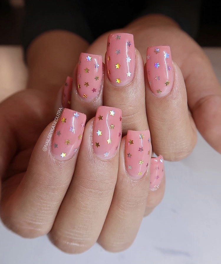 Tender pink and shiny star nails