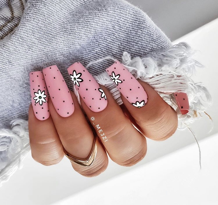 Matte pink flowers with long acrylic nails