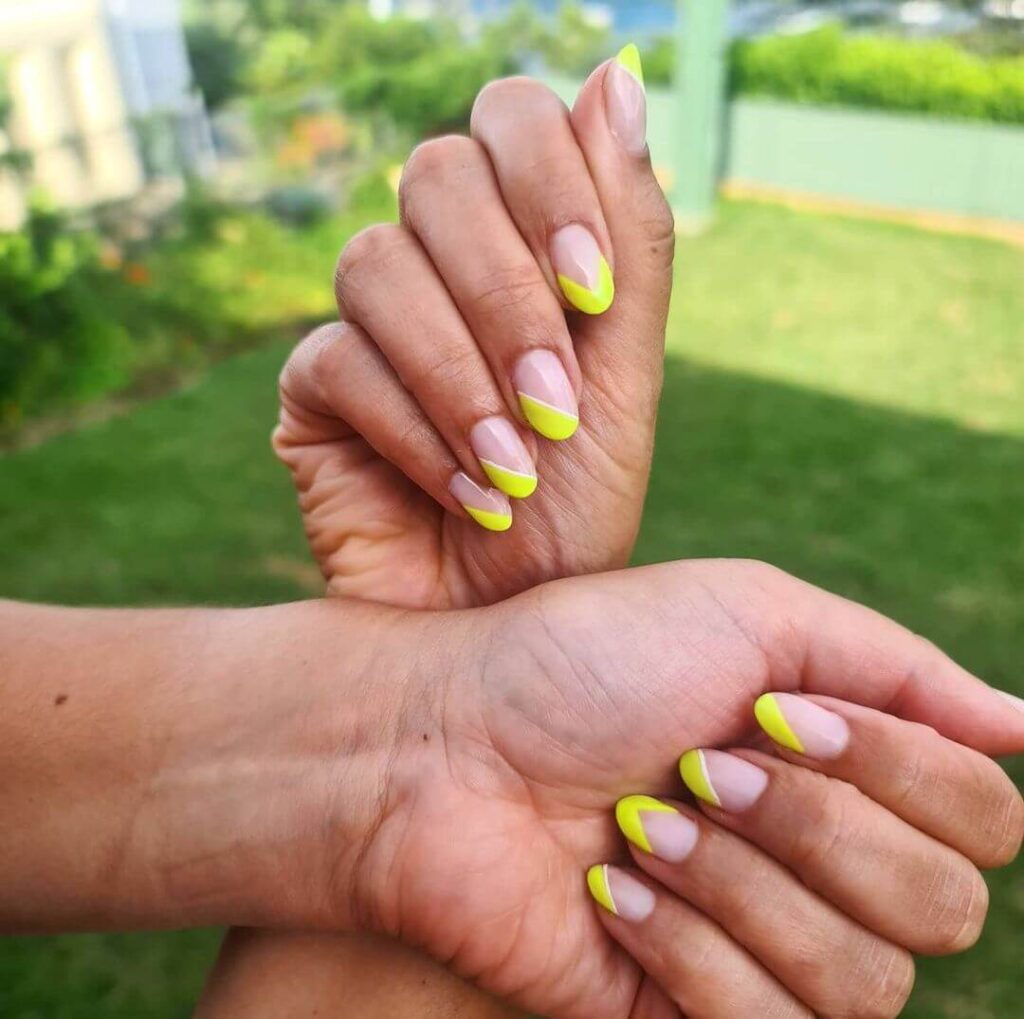 Fluorescent yellow almond nails