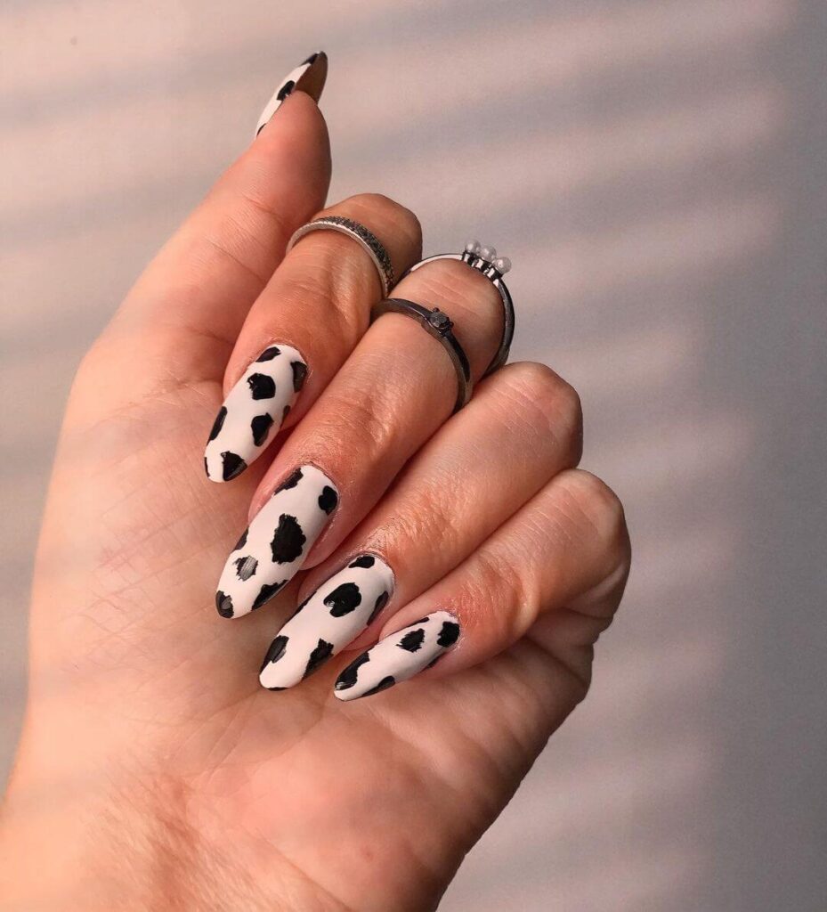 Cow print almond nails