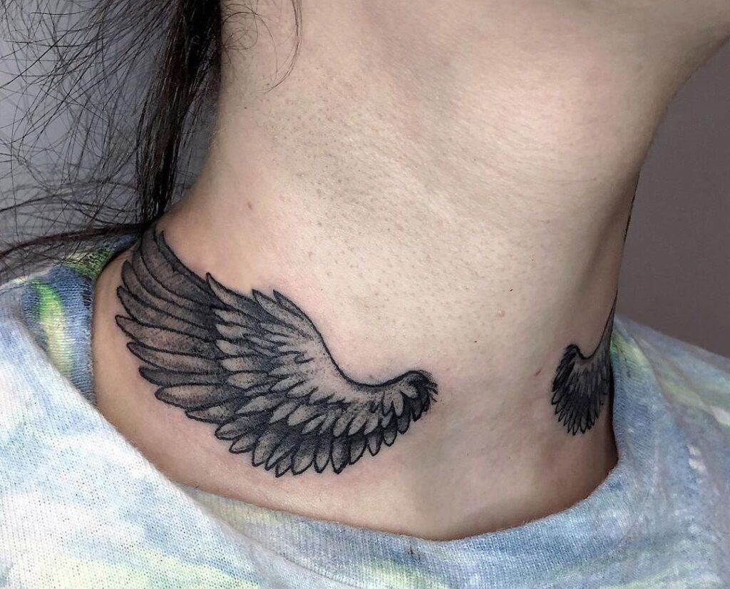 Wings front neck tattoo
