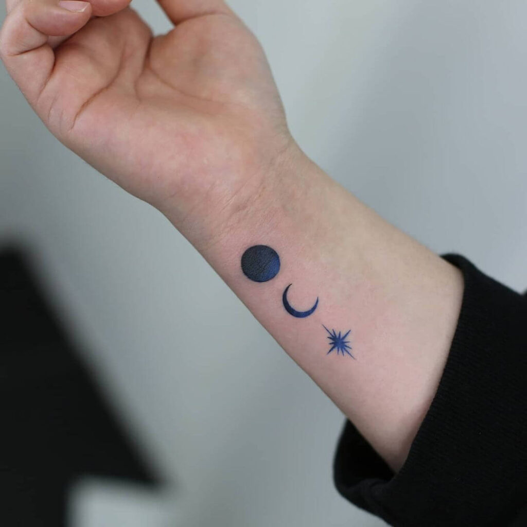 Dark blue moon tattoo