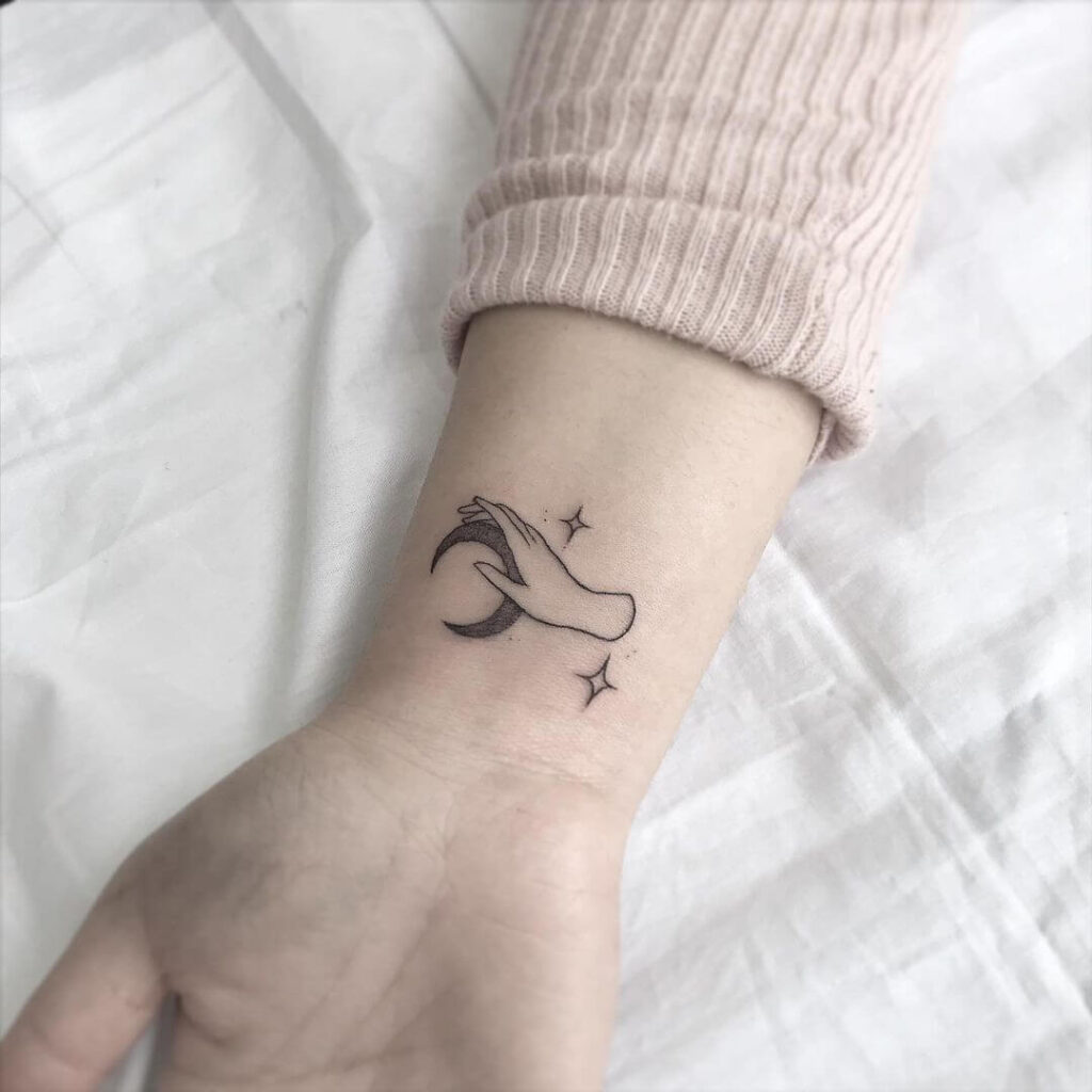 Simple but beautiful small moon tattoo