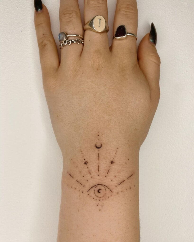 Wrist moon tattoo
