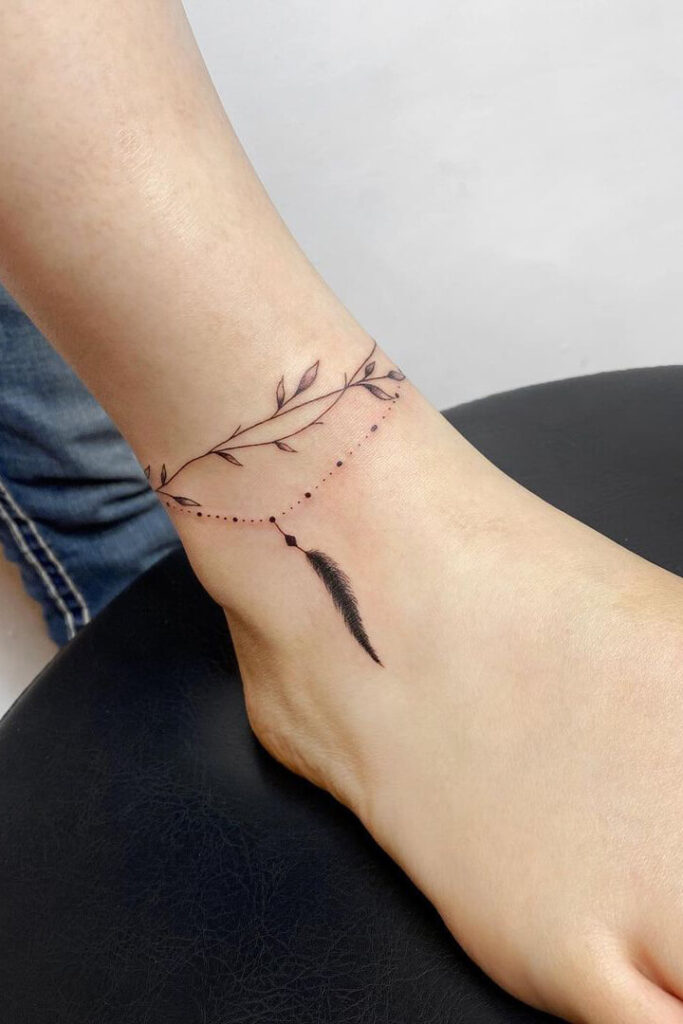 Classic feather anklet tattoo