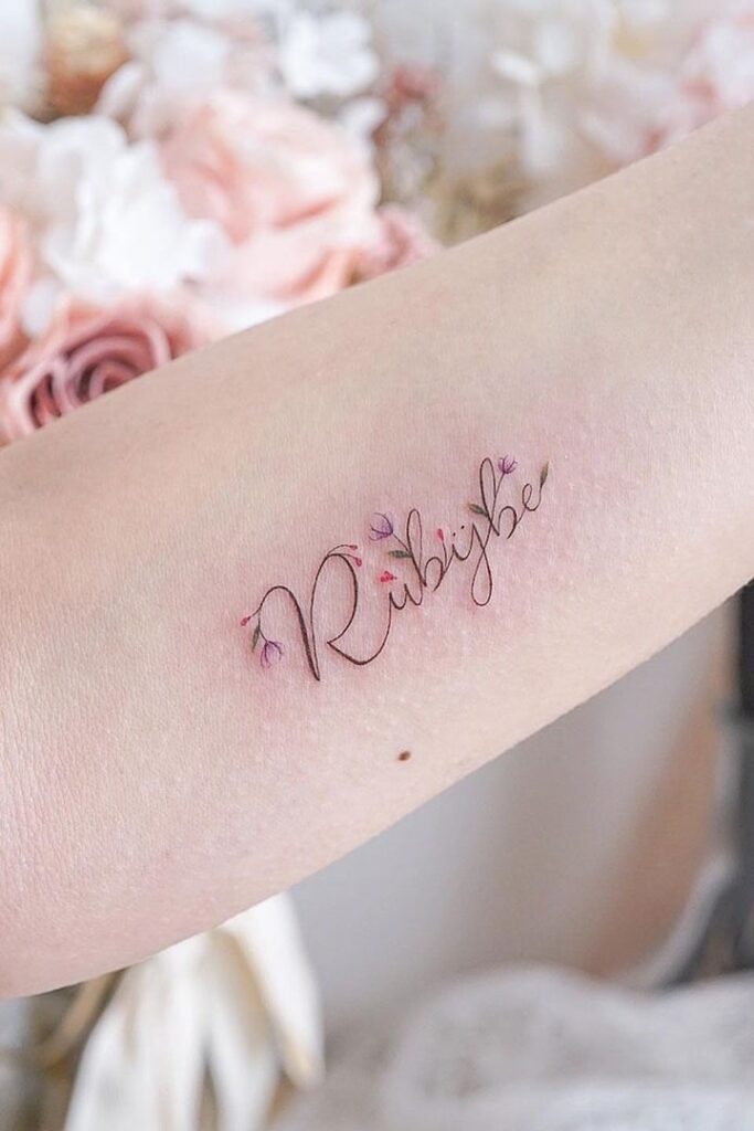 quote tattoo with flowers