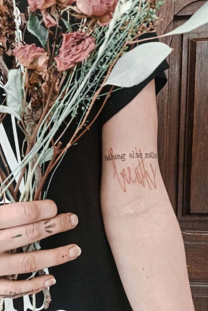 Two-tone quote tattoo