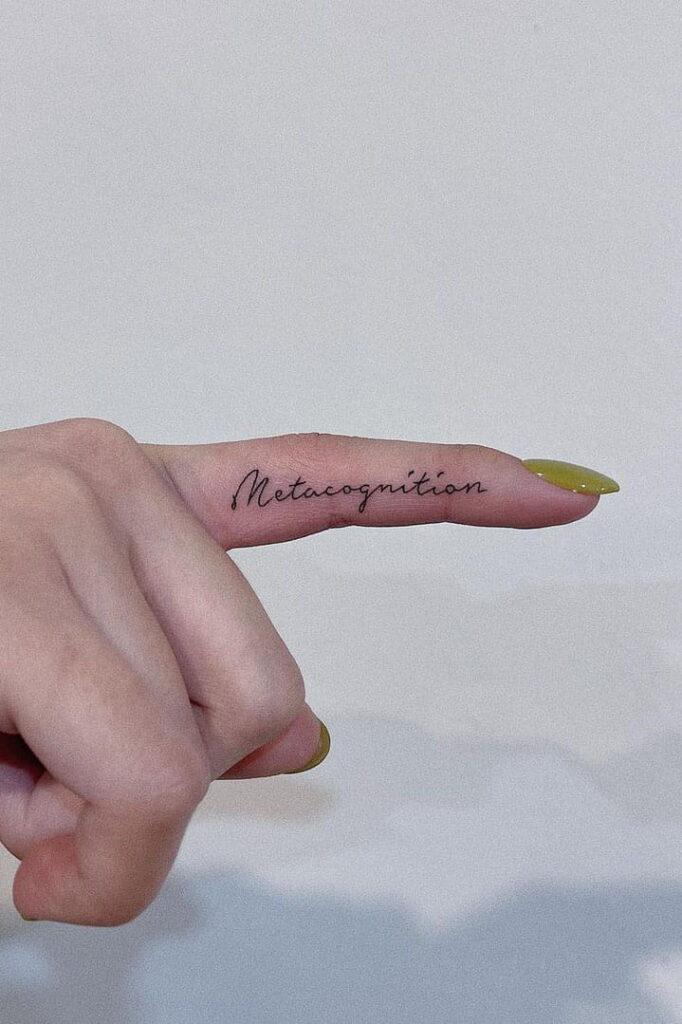 Quote tattoo on finger