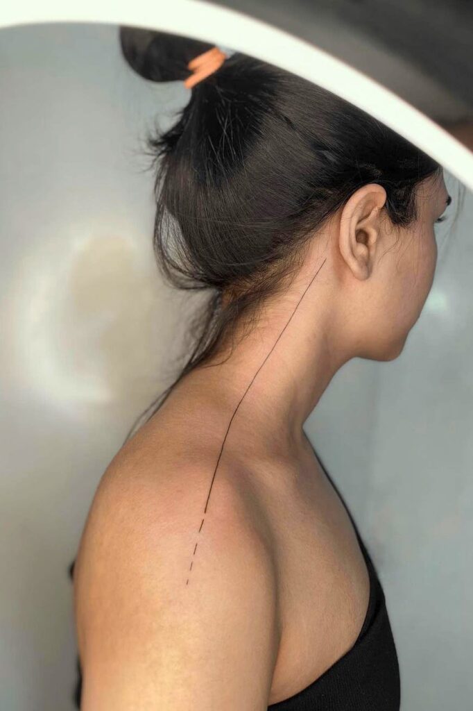 Line tattoo on shoulder