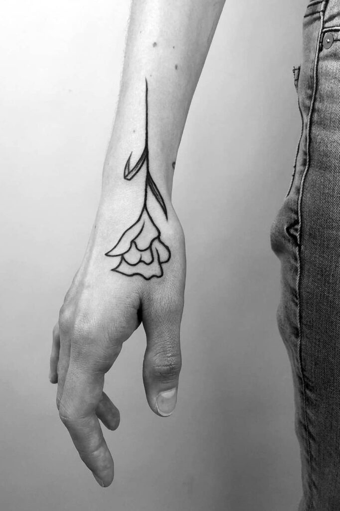 Floral line tattoo on hand