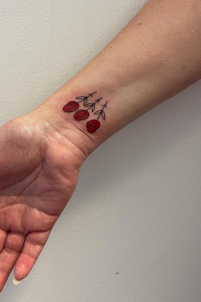 Small rose tattoo on wrist