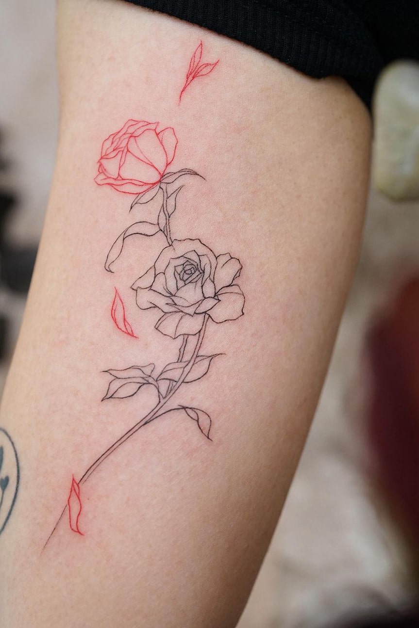 Black and red rose tattoo