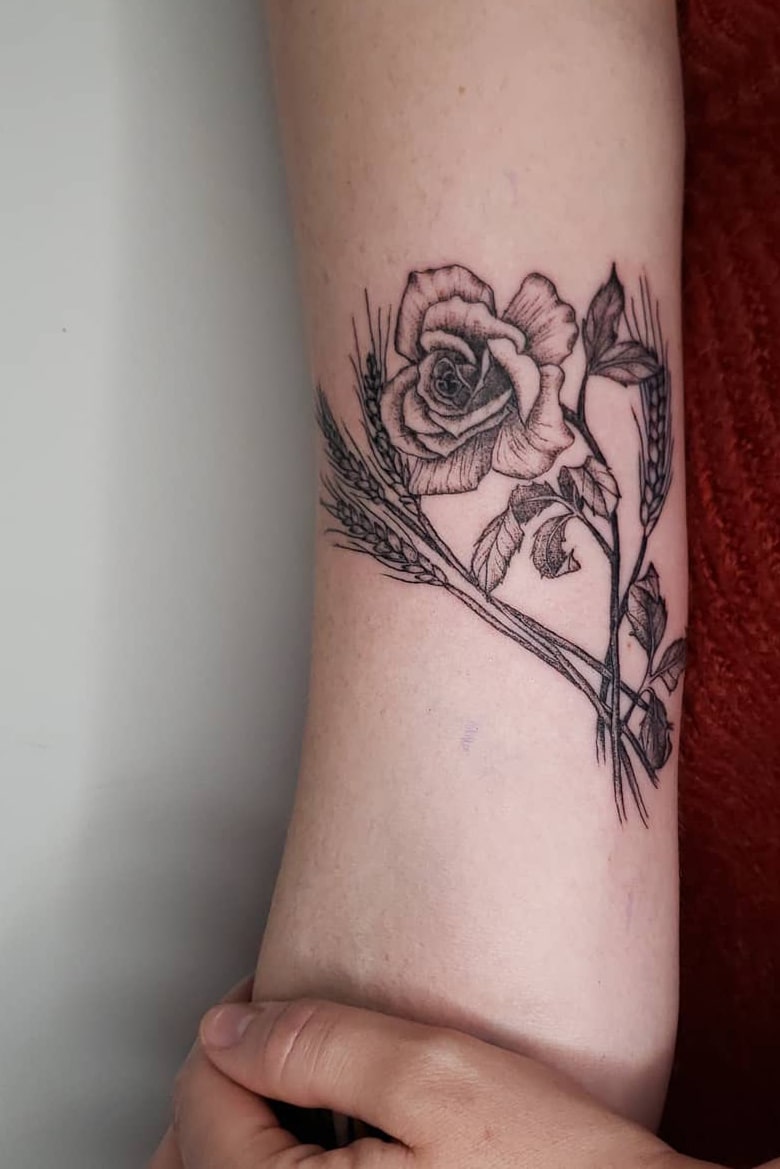 Elegant rose tattoo