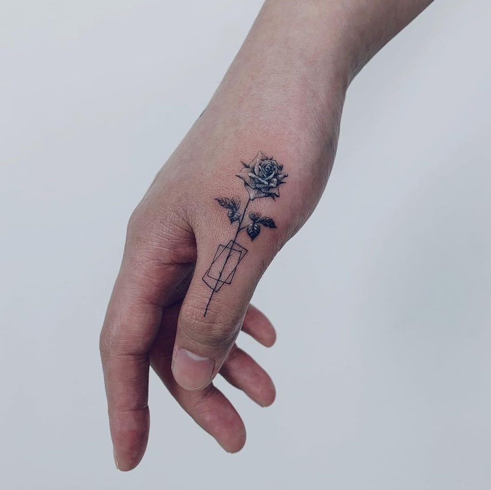 Rose tattoo on finger