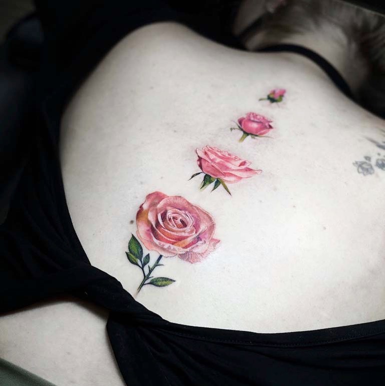 Charming rose tattoo on back