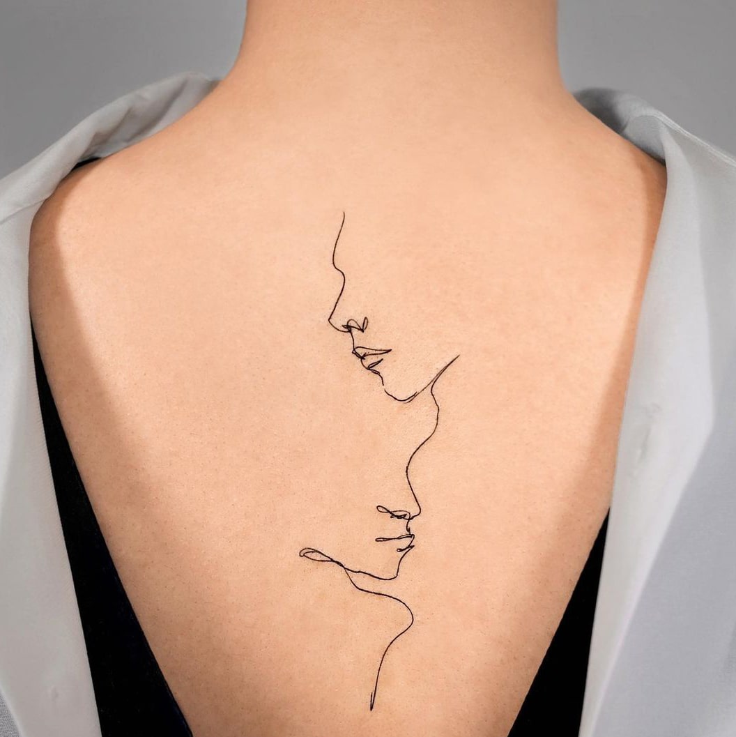 Line outline back tattoo