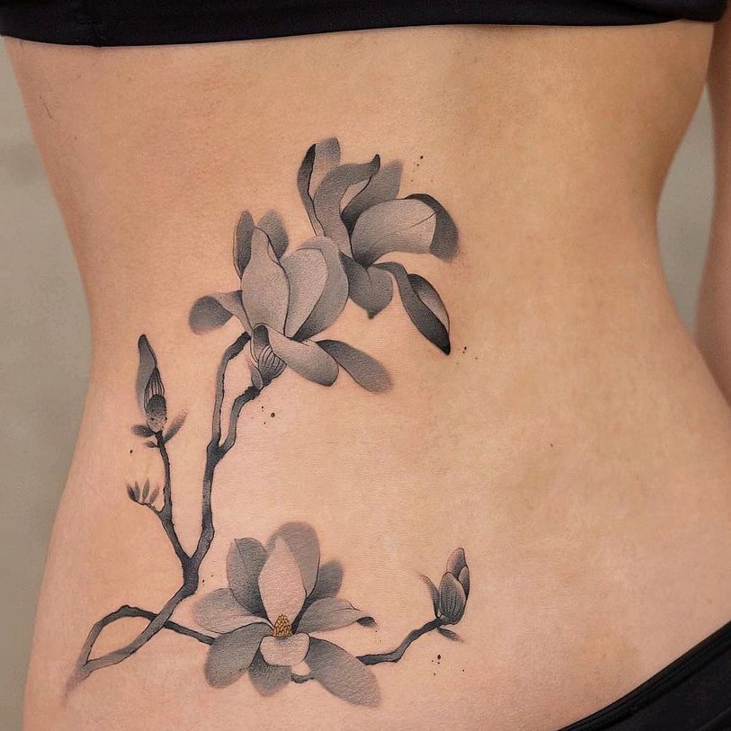 Lower side back tattoo