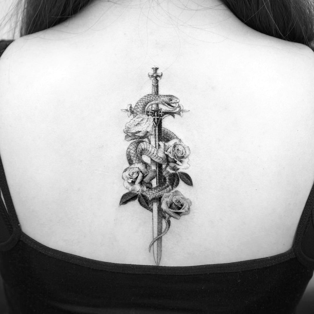 Snake back tattoo