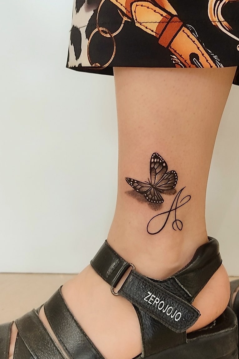 3D butterfly tattoo on ankle