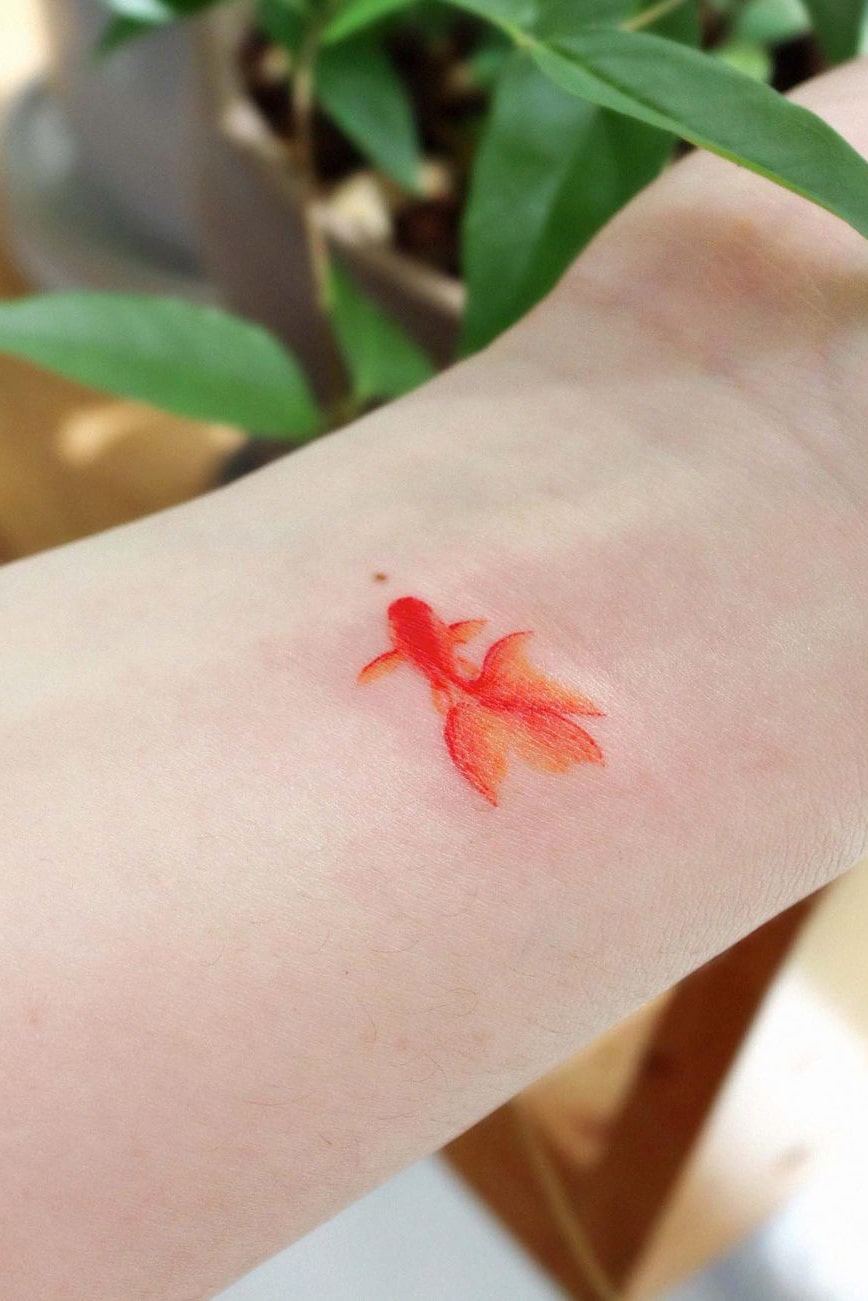 Small goldfish colorful tattoo