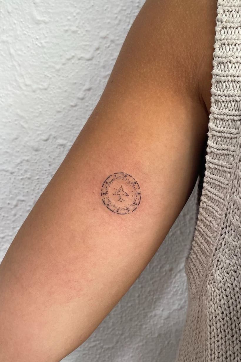 Creative tiny airplane tattoo