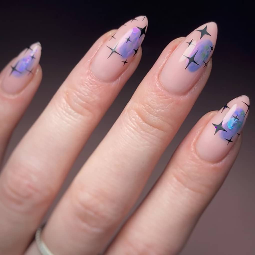 Elegant almond galaxy nails