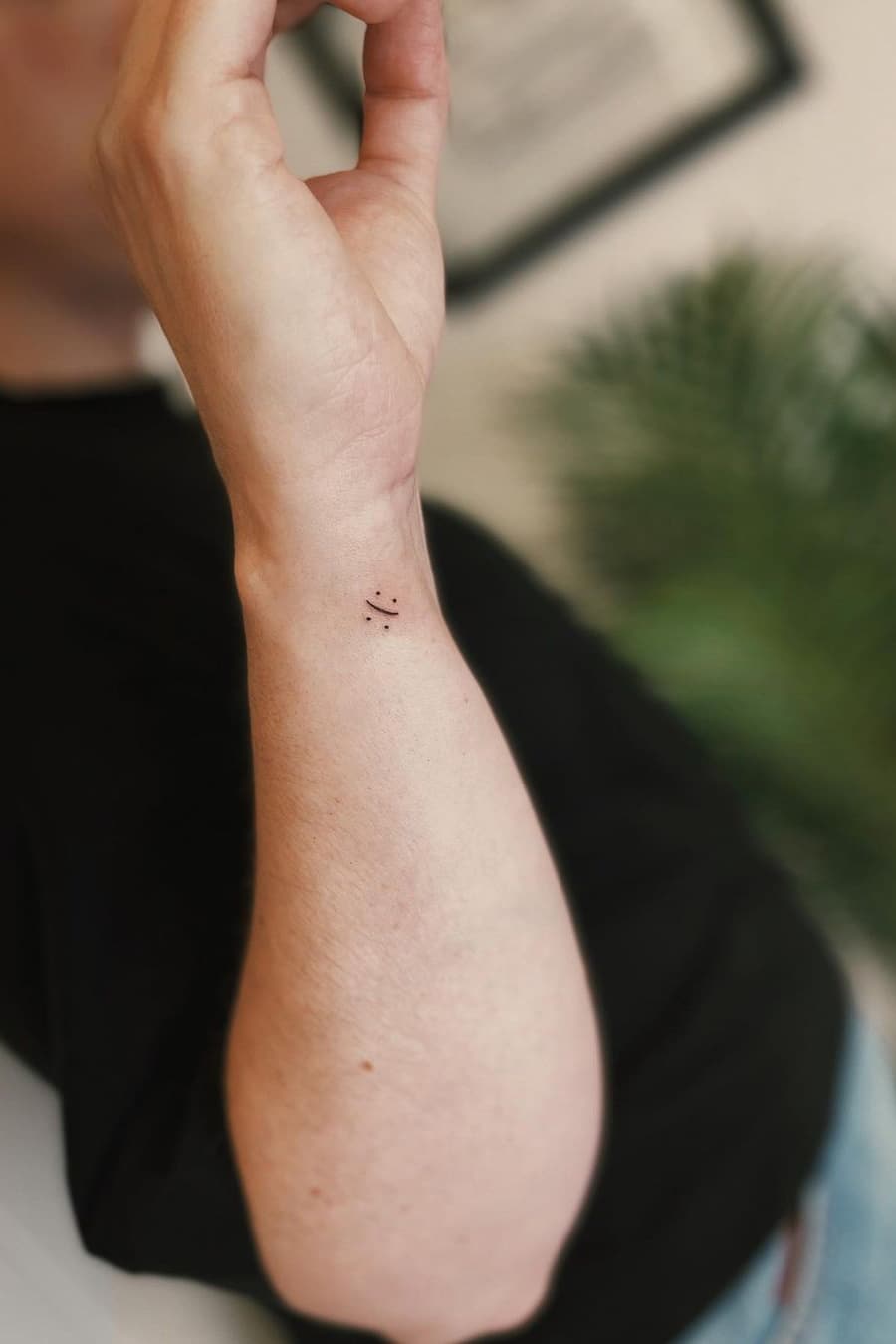 Happy and sad tiny tattoo