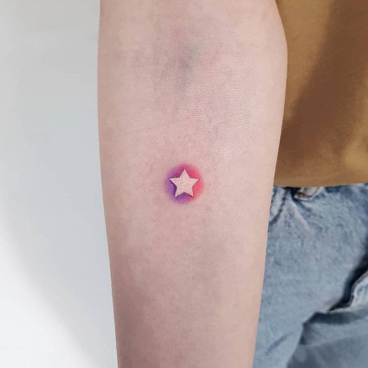 Tiny star tattoo with beautiful background