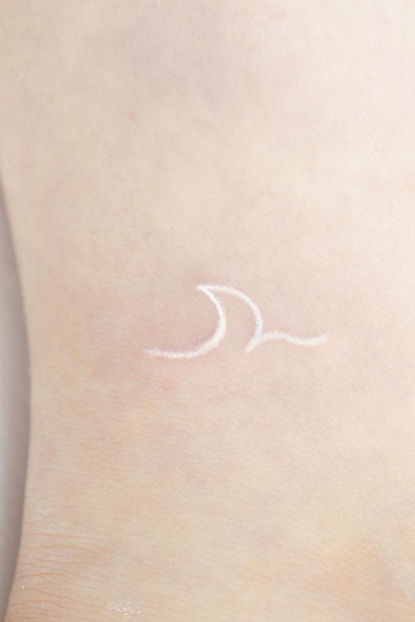 White wave tattoo