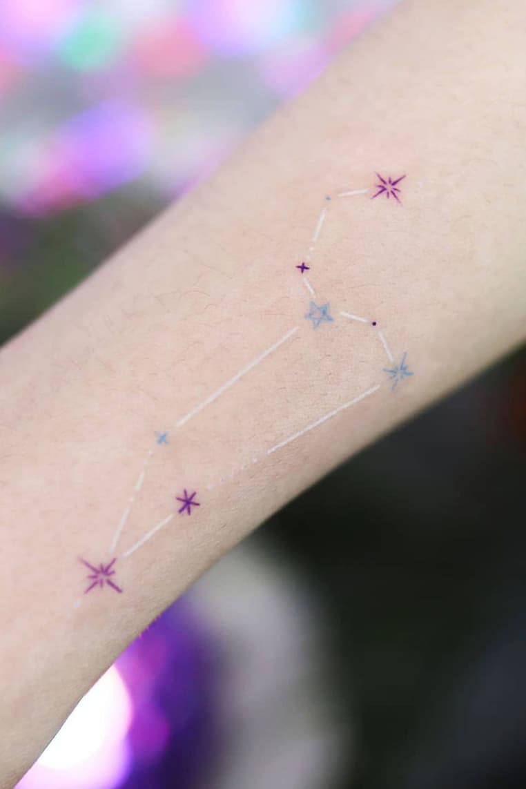 White zodiac tattoo