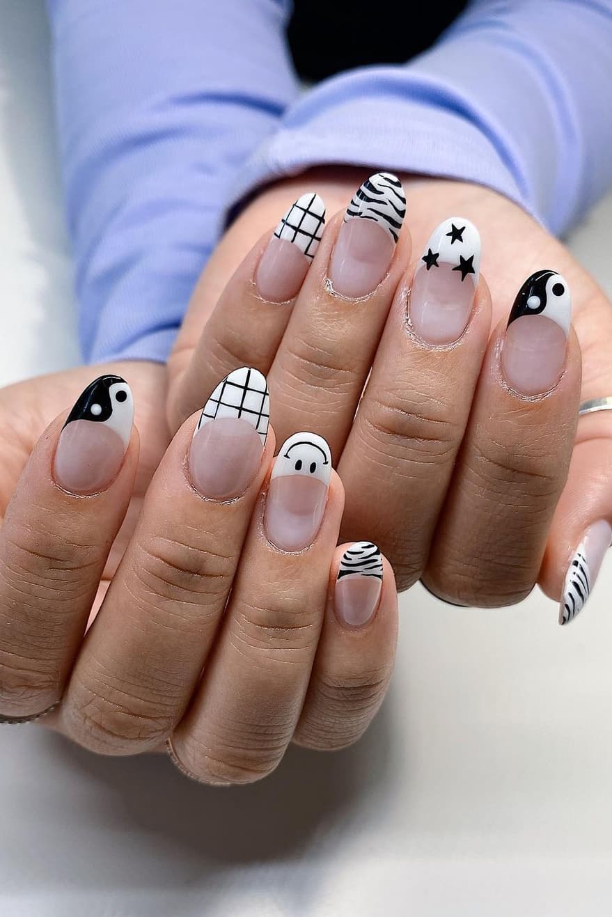 Black and white nails with mixed themes