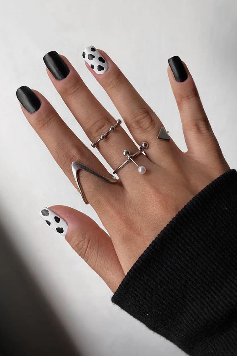 Cow print black and white nails