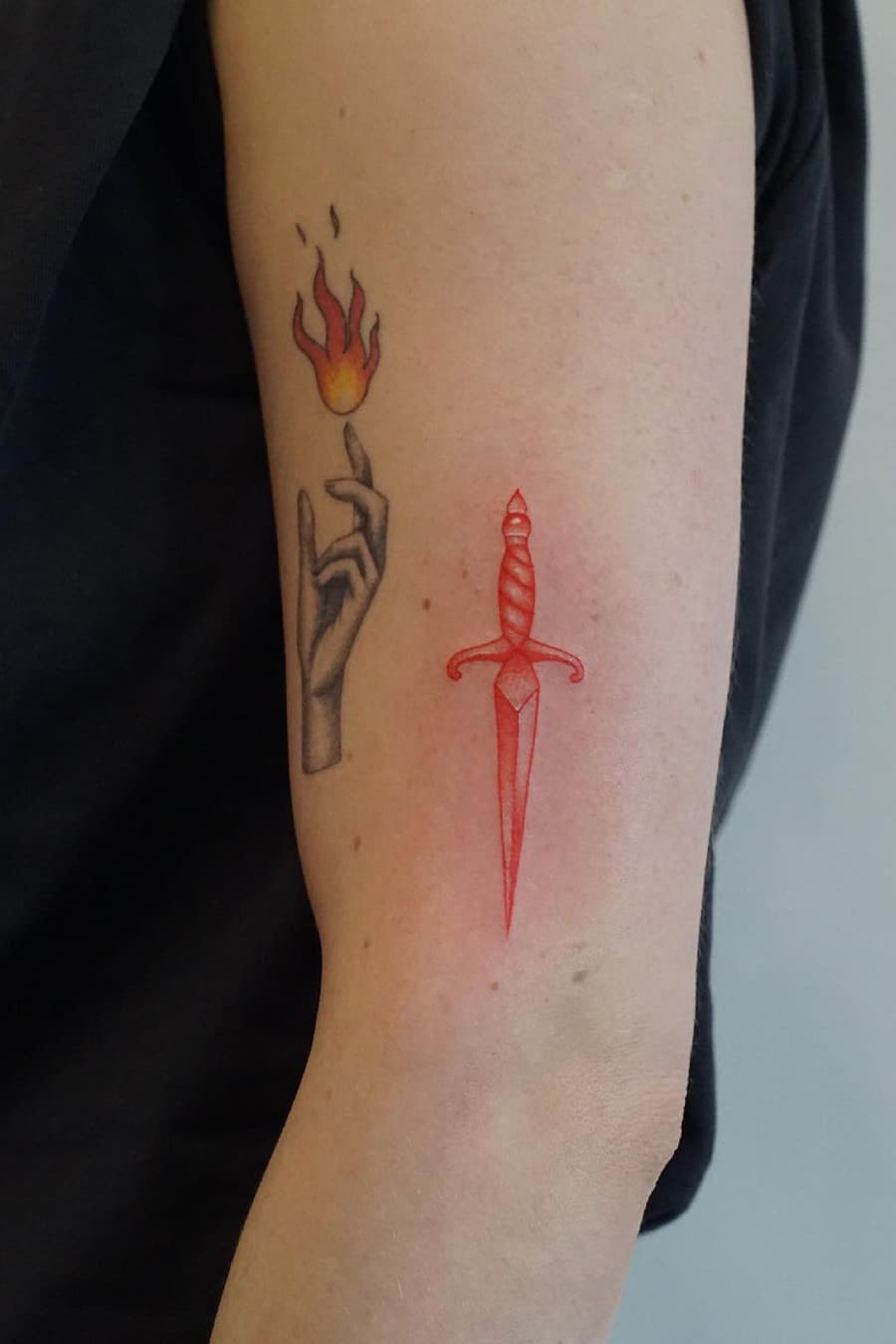 Red dagger tattoo