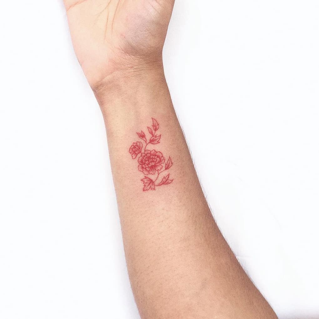 Red flower tattoo