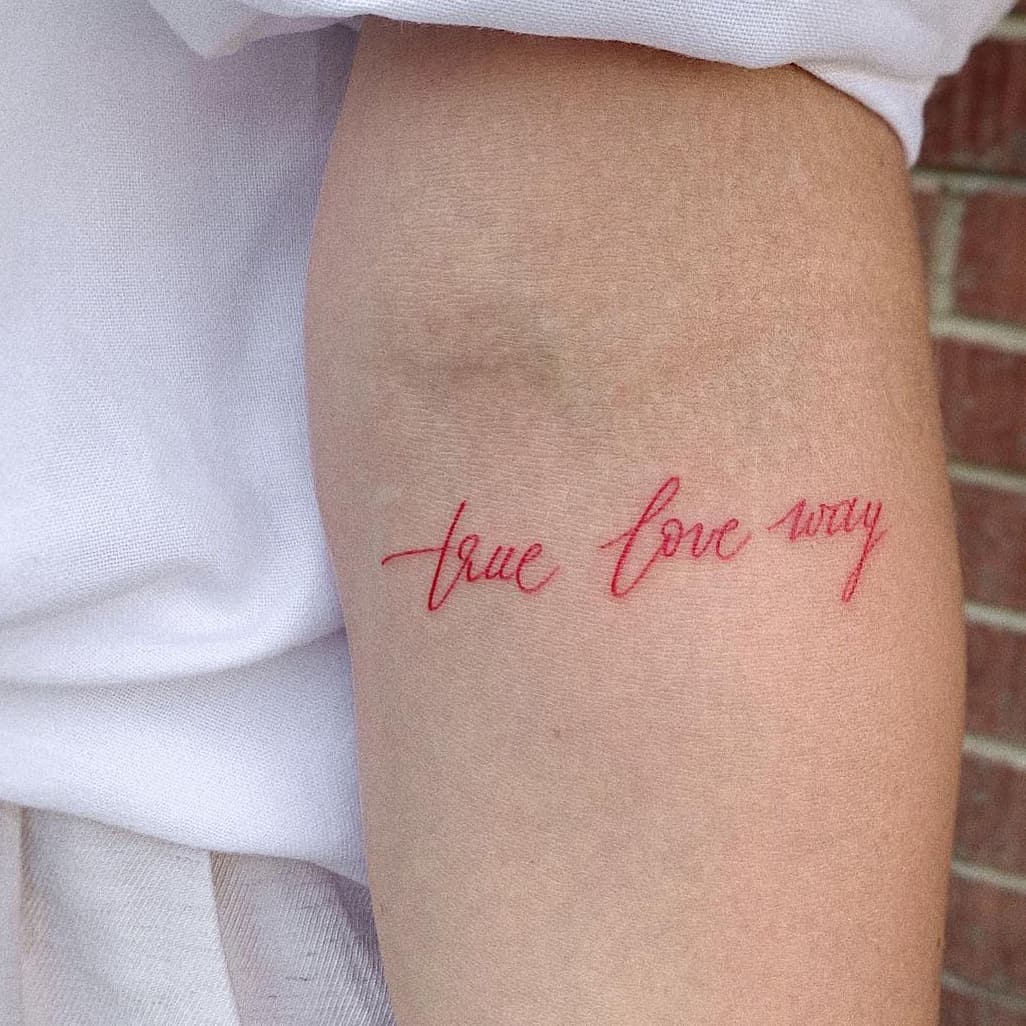 Red quote tattoo