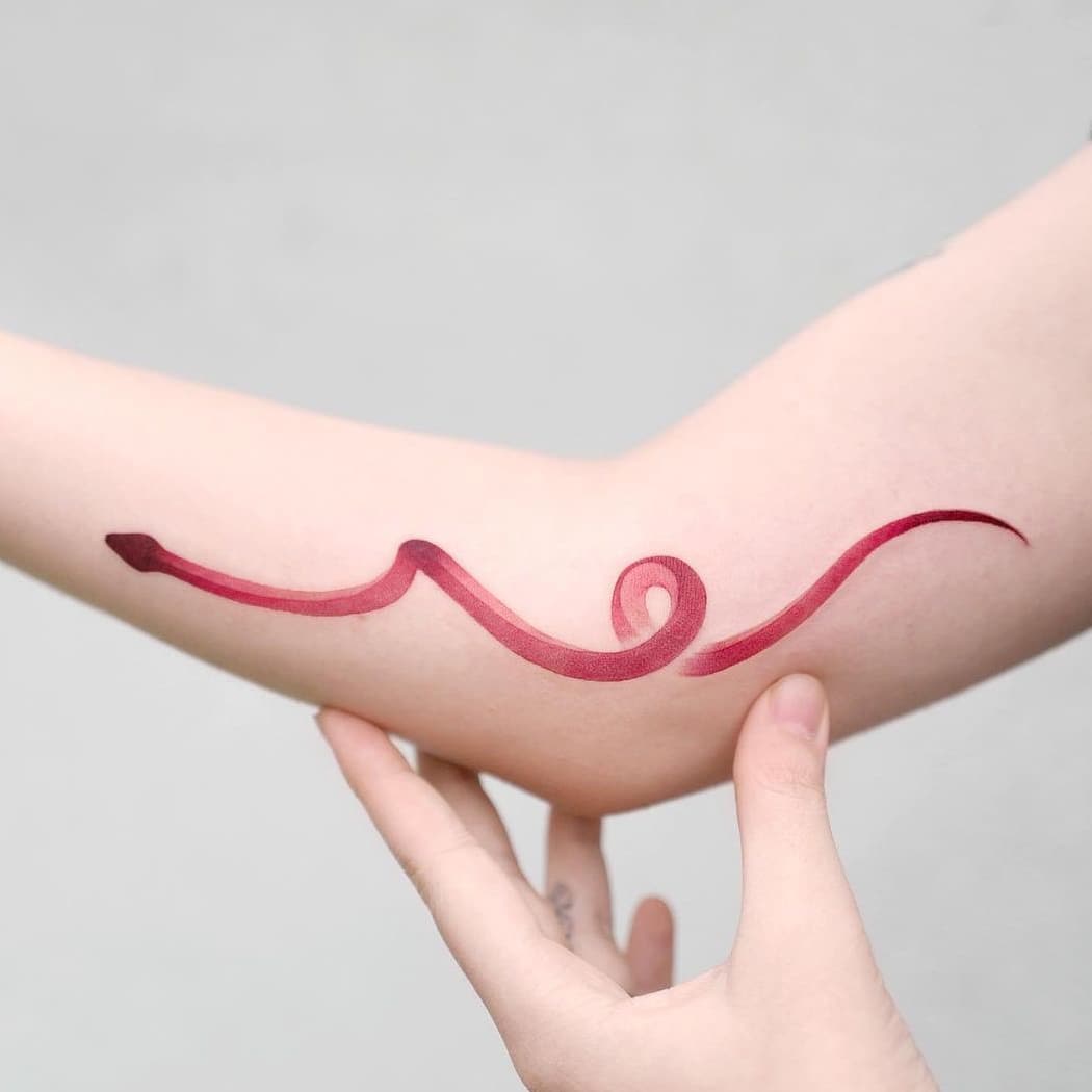 Red snake tattoo