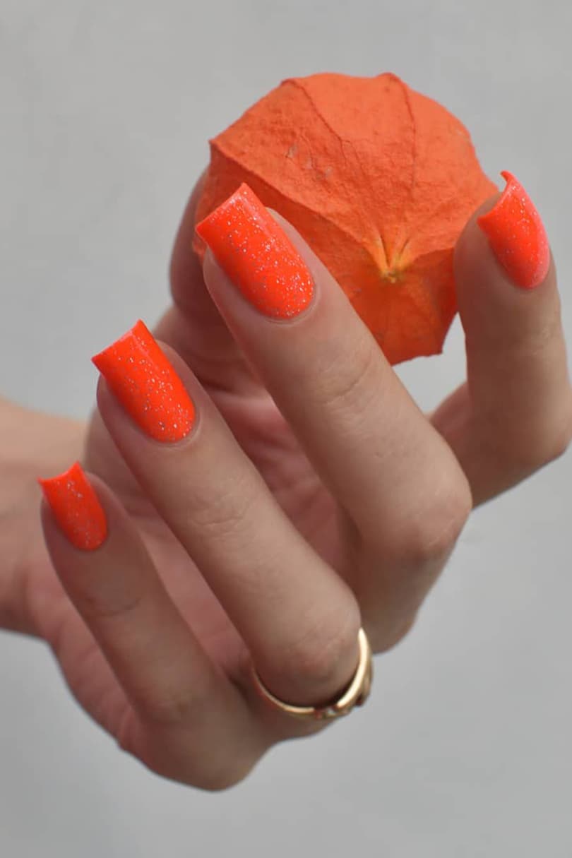 Shining orange coffin nails