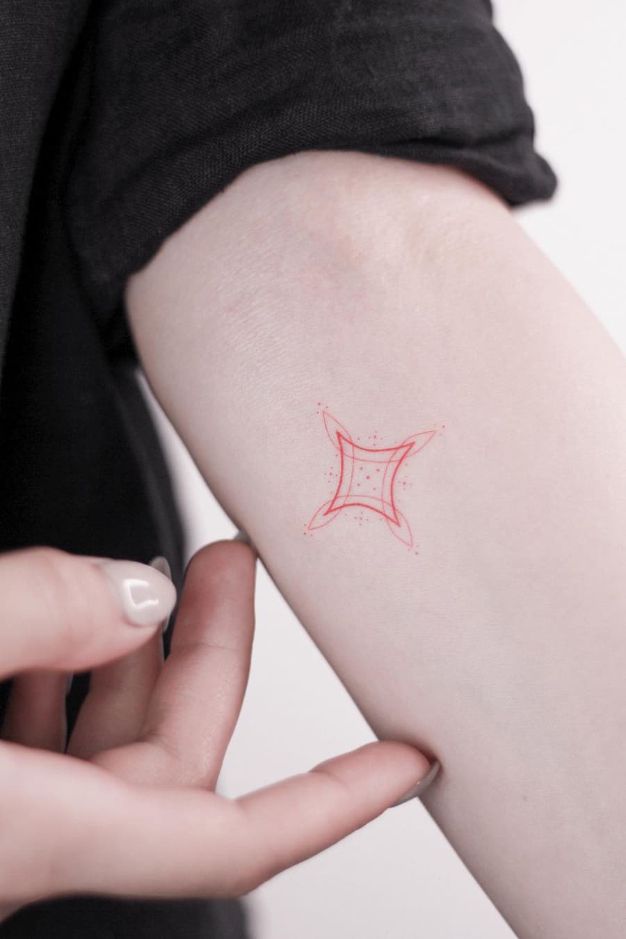 Small red tattoo