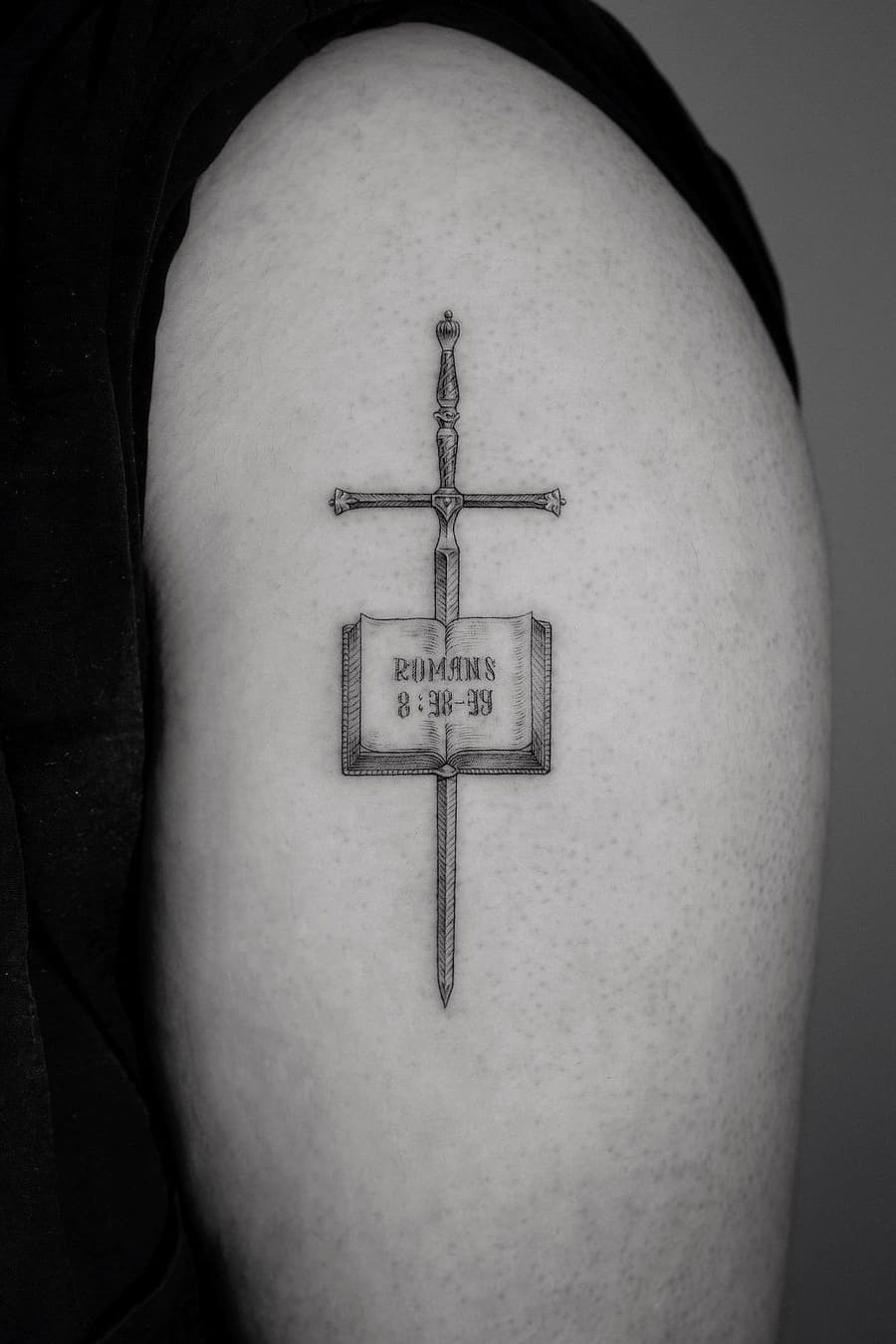 Book sword tattoo