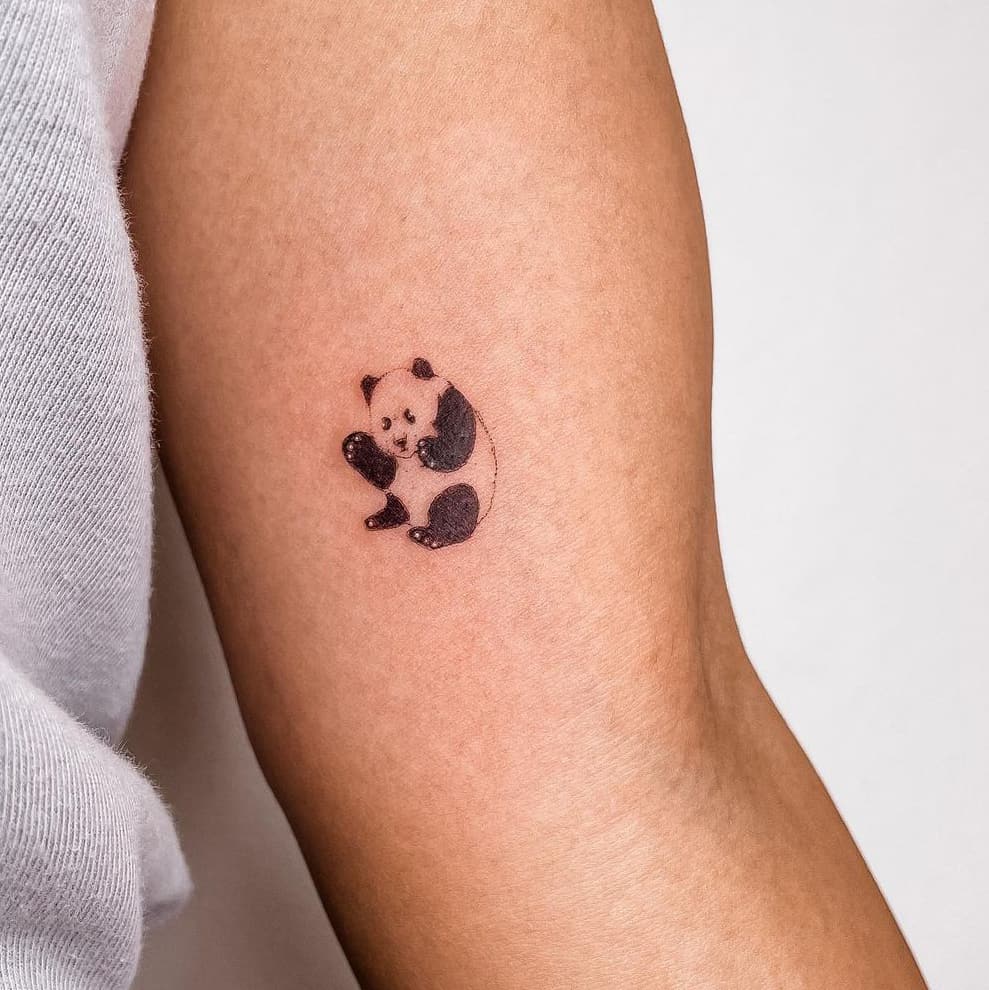 Delicate panda tattoo