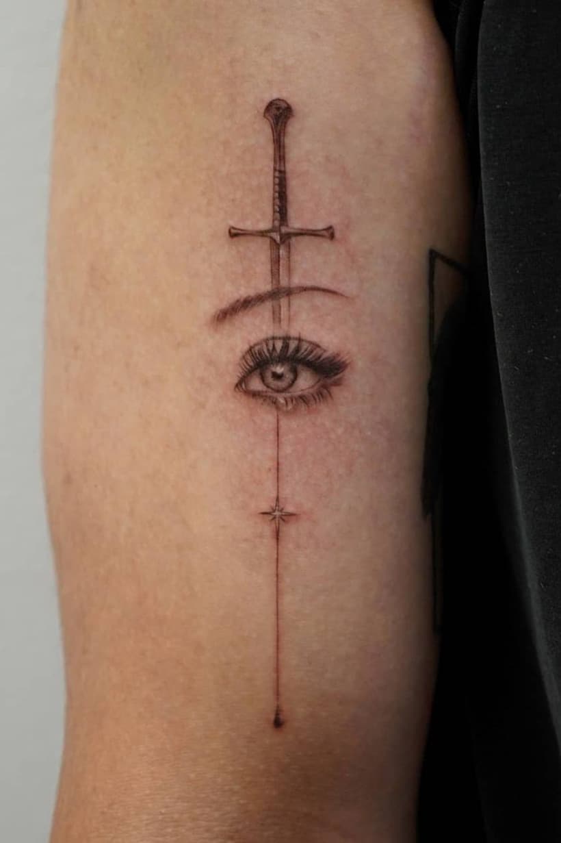 Eye sword tattoo