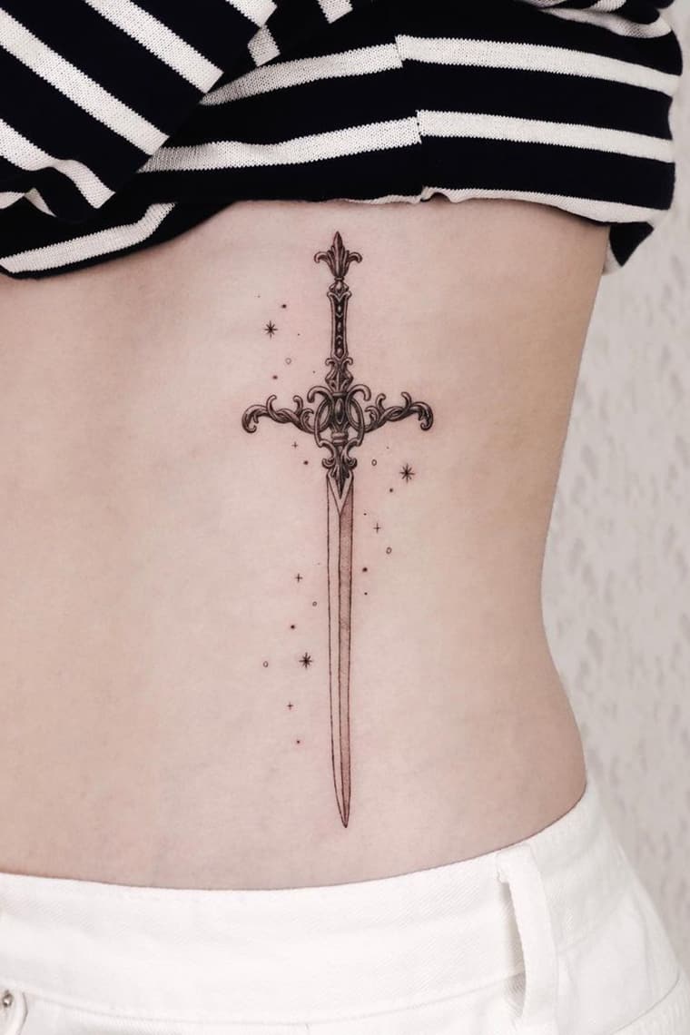 Glittering sword tattoo