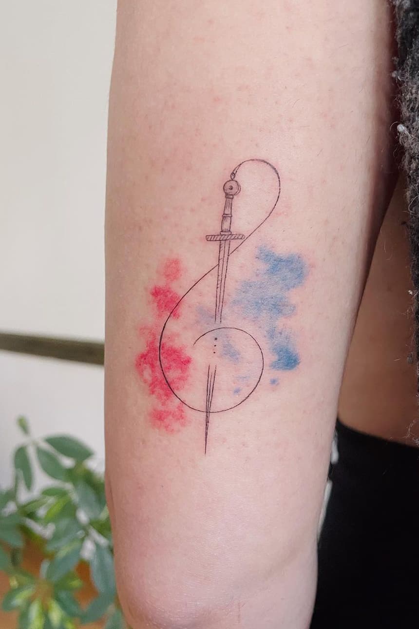 Musical note sword tattoo