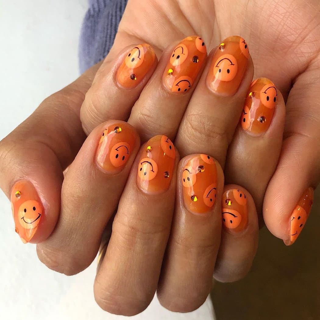 Orange jelly smiley nails