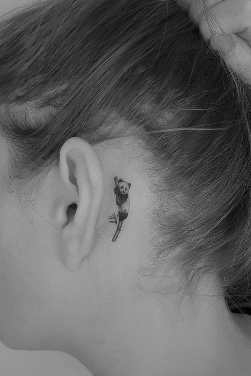 Panda tattoo behind the ear