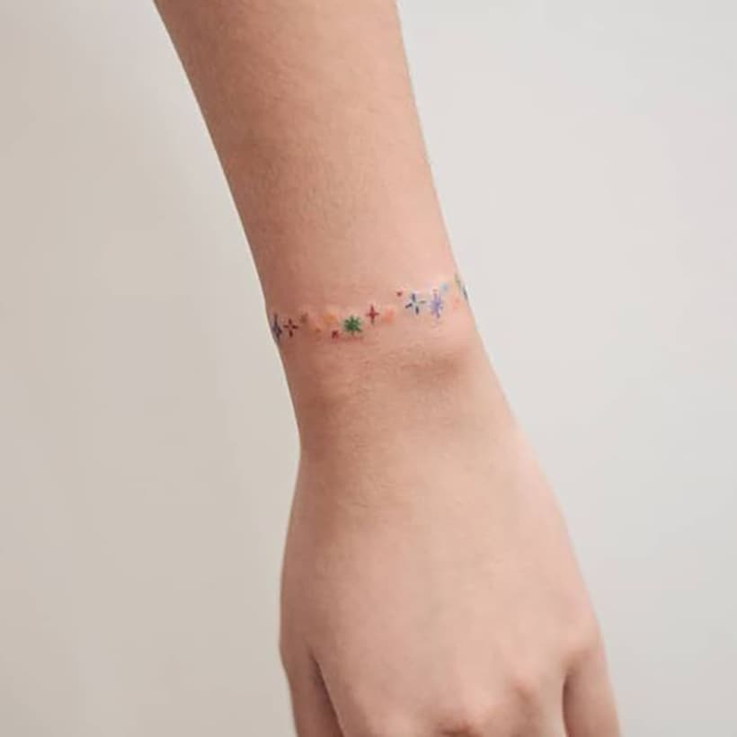 Rainbow bracelet tattoo