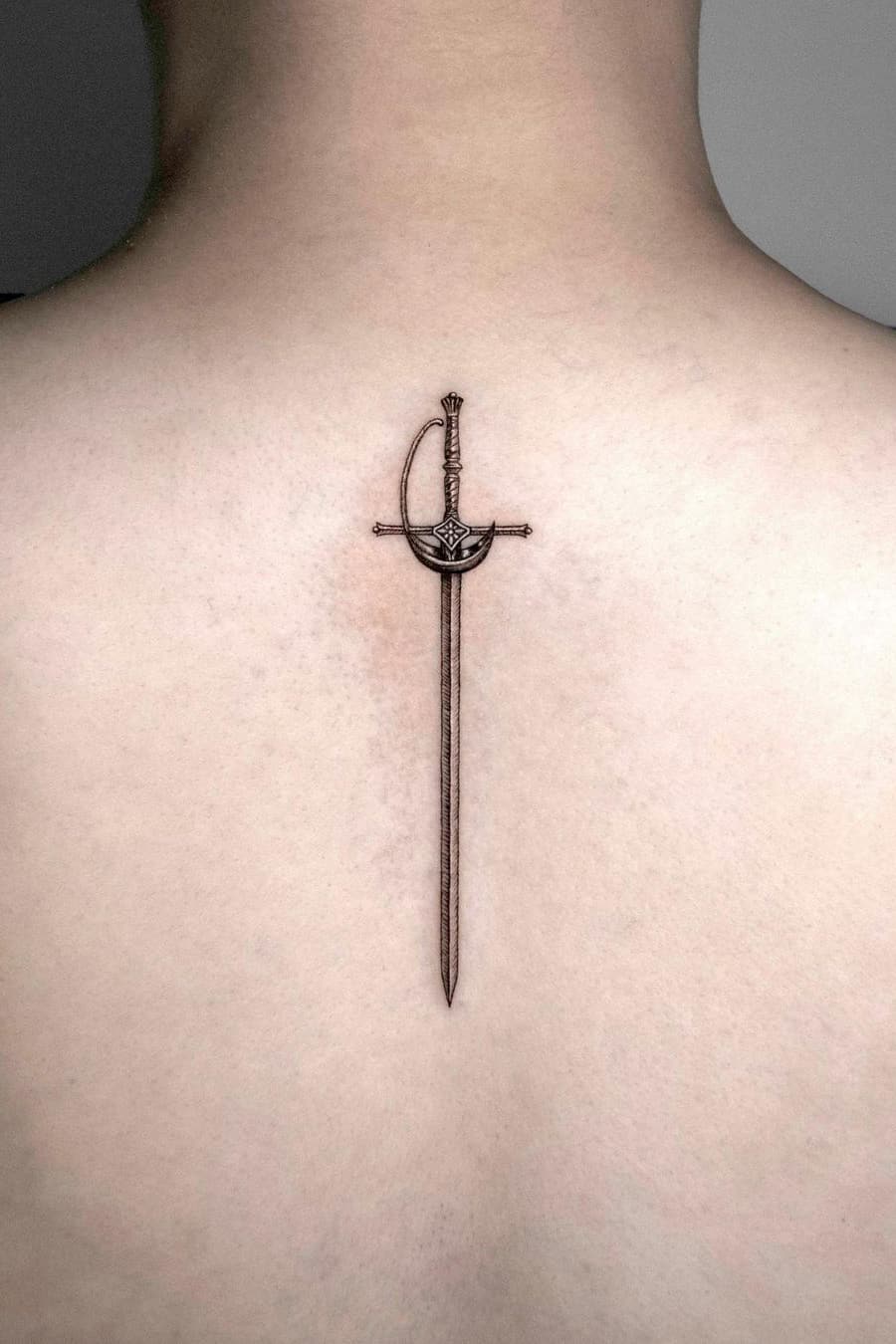 Realistic sword tattoo