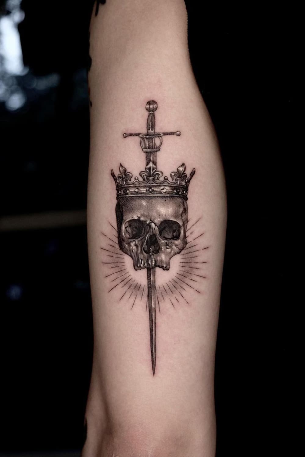 Skull sword tattoo