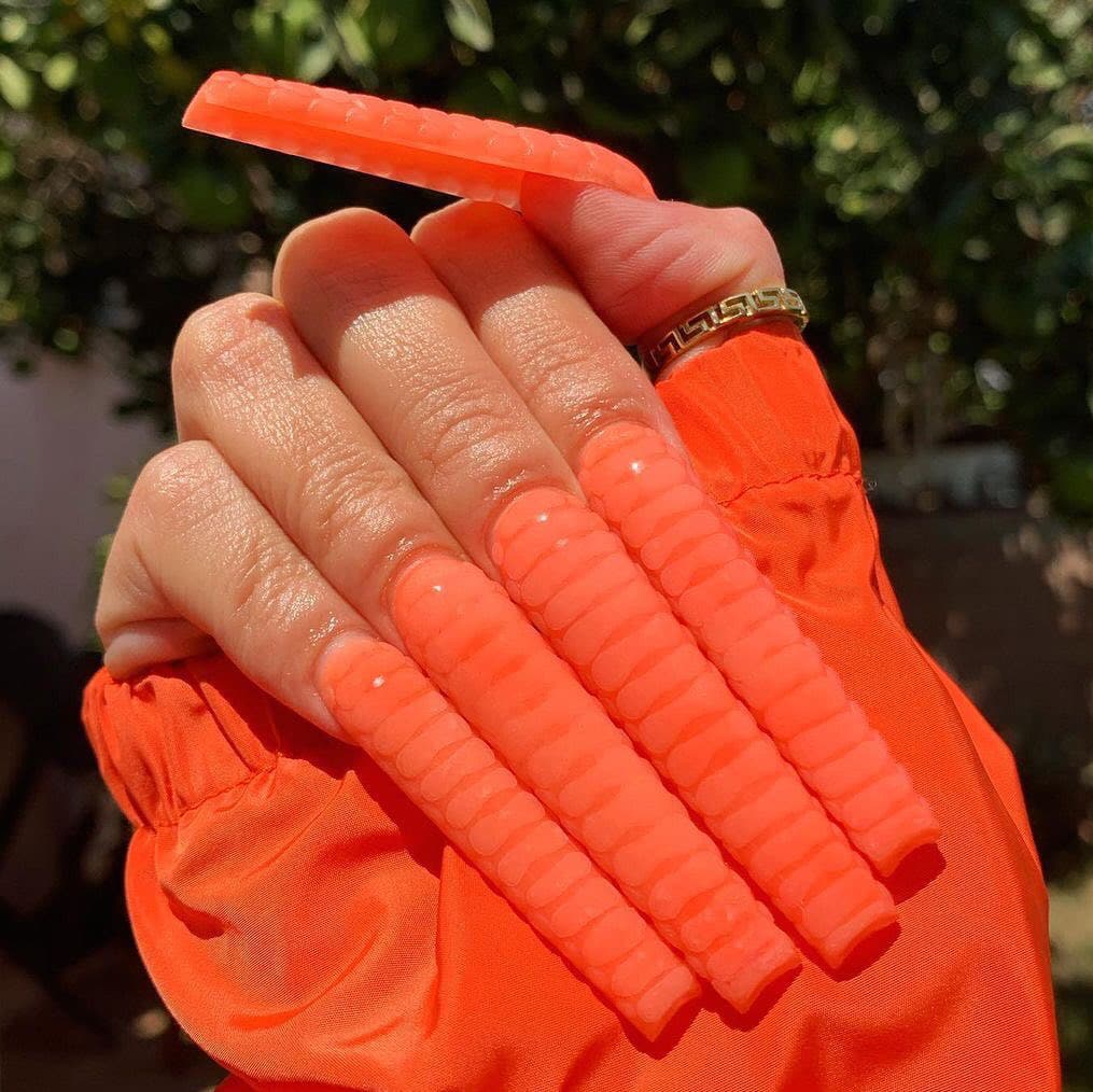 Vibrant orange super long Halloween nails