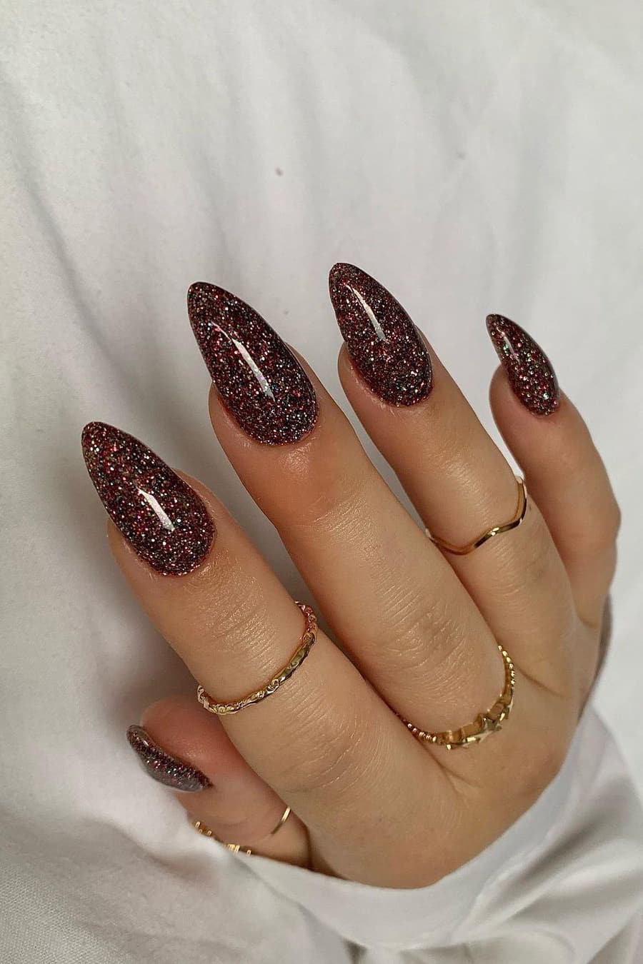 Shiny brown almond nails